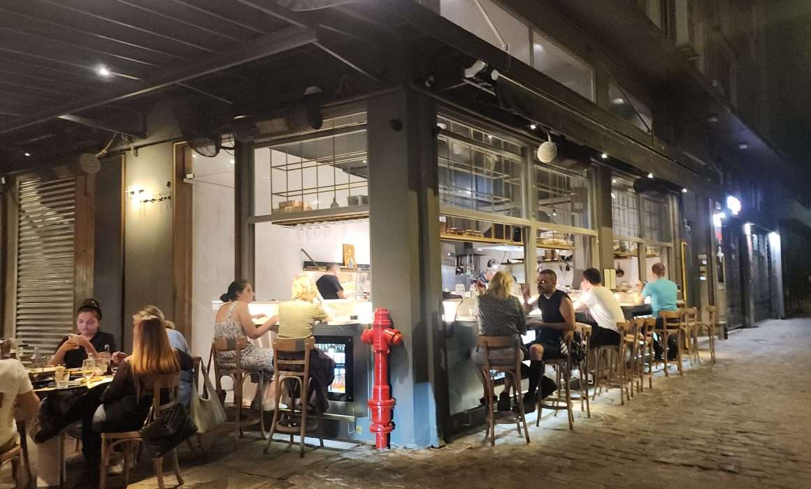 People eating at street restaurant